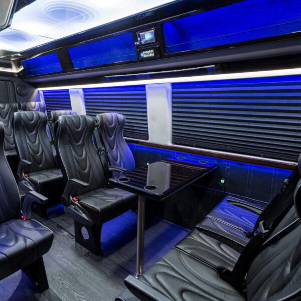 interior view of executive coach sprinter shuttle focused on table and bar seating