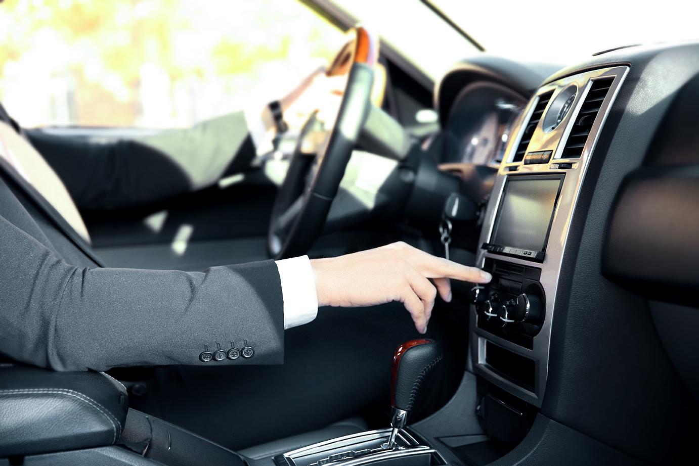 Interior view of a man driving a luxury suv limo