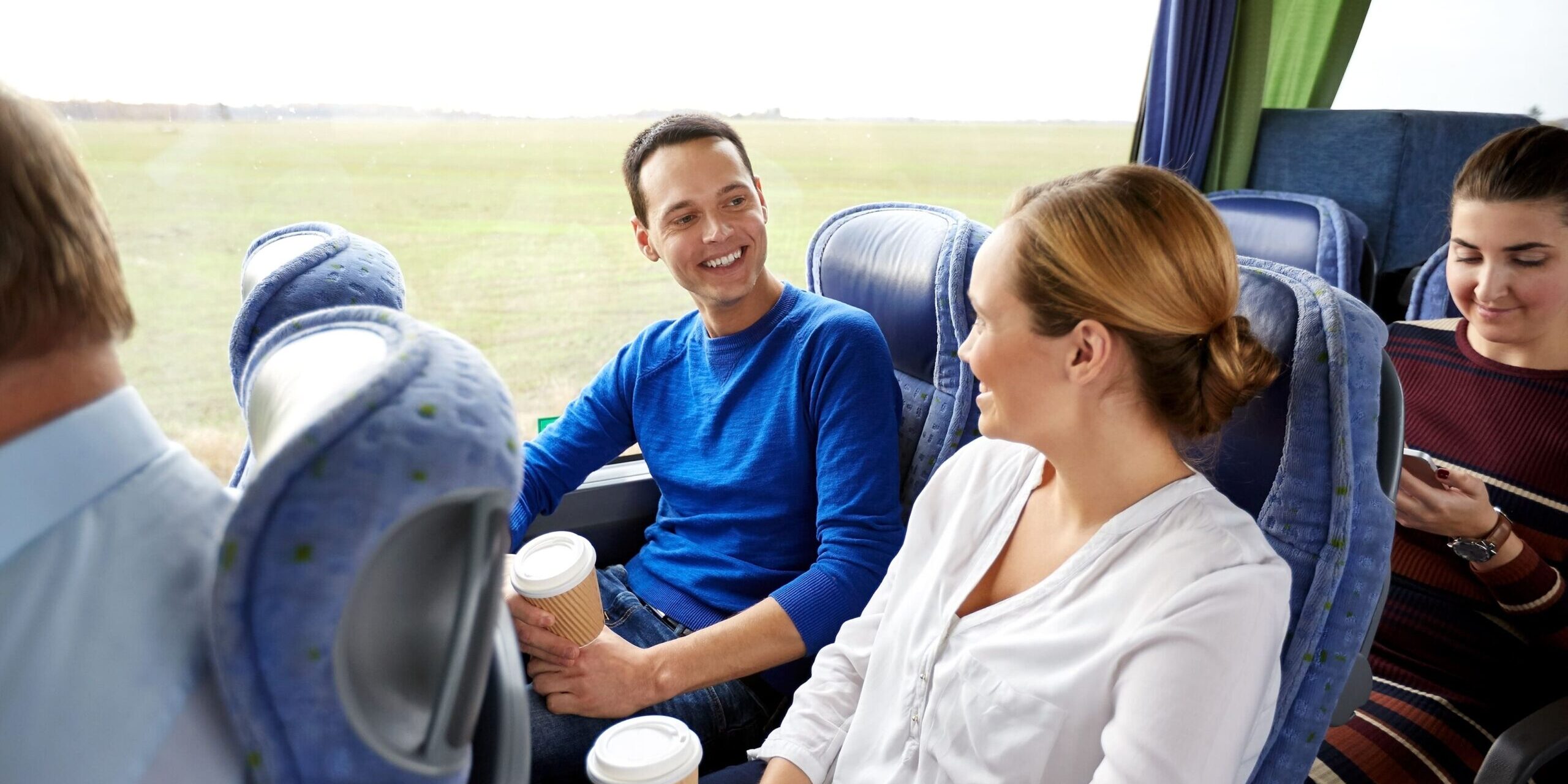 happy people in a safely-operated coach bus