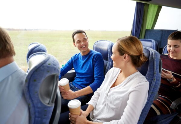 happy people in a safely-operated coach bus