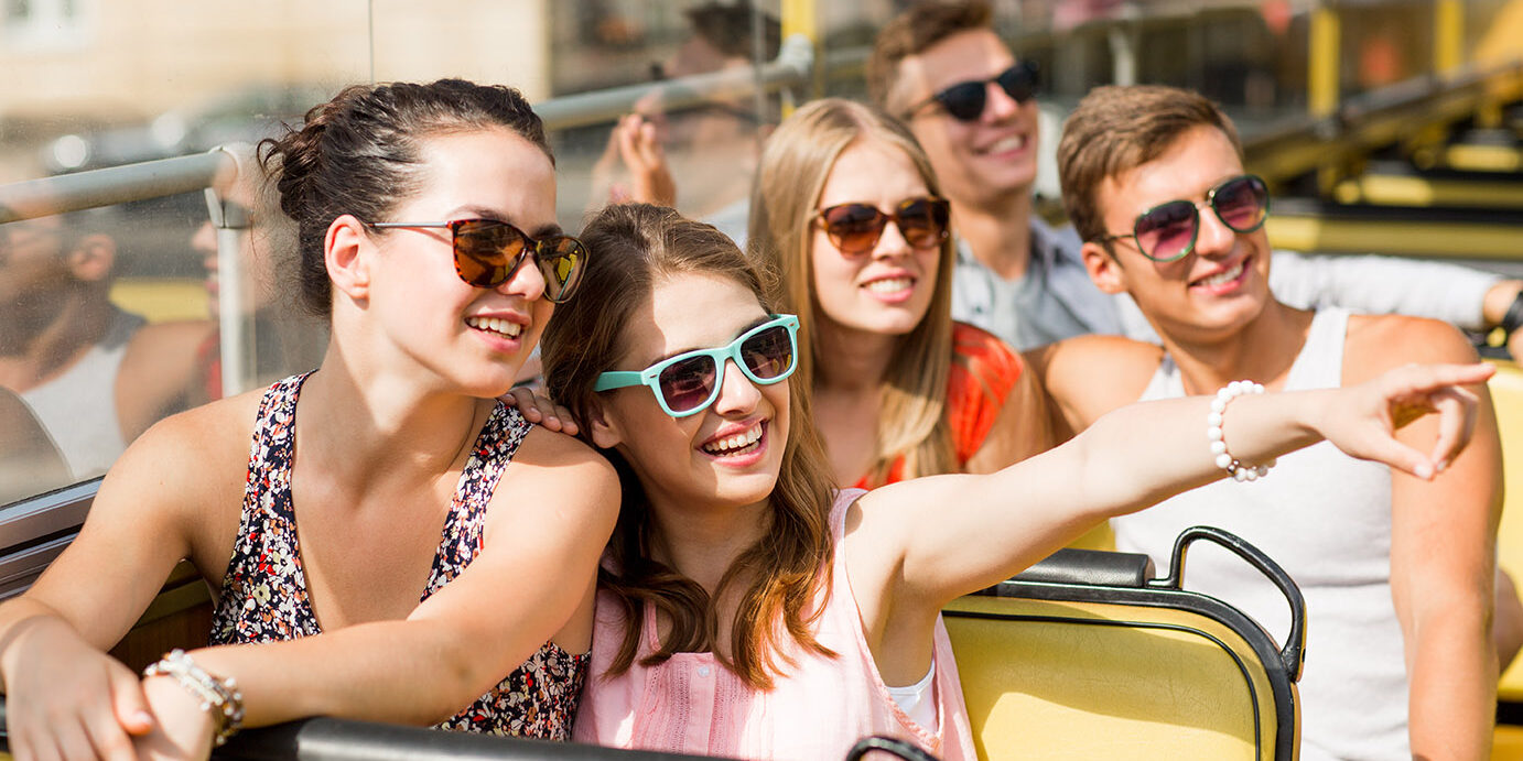 shutterstock_208892407 Group enjoying tour on coach bus