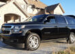 SUV limousine parked in a driveway