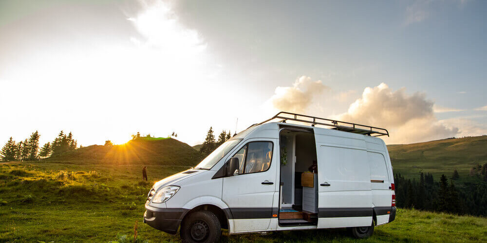 Mercedes Sprinter Van with ladder Luxury Mercedes sprinter van parked in a field