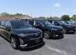 Row of black Cadillac funeral cars lined up for professional service use