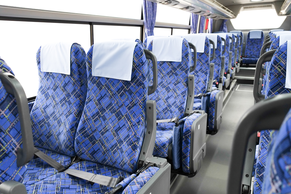 City bus interior with upright patterned seating