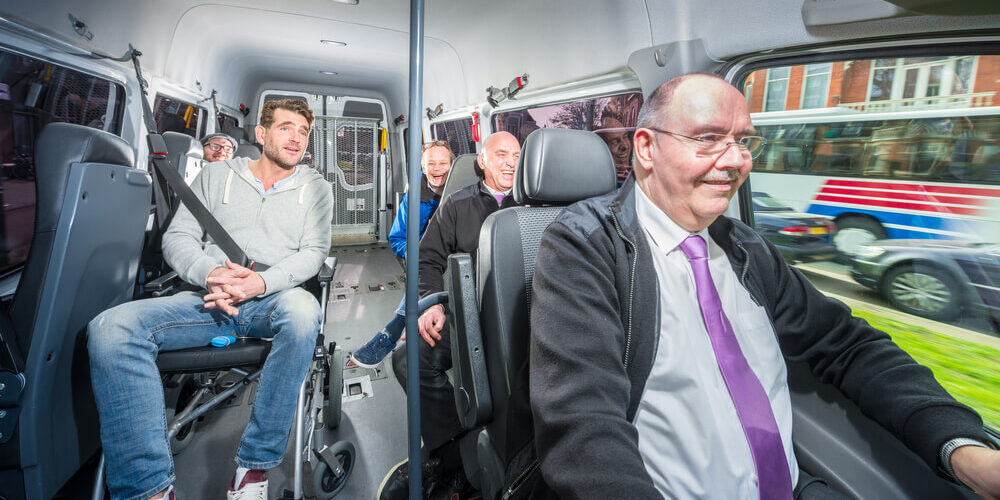 Employees on a shuttle bus A group of employees riding a shuttle bus