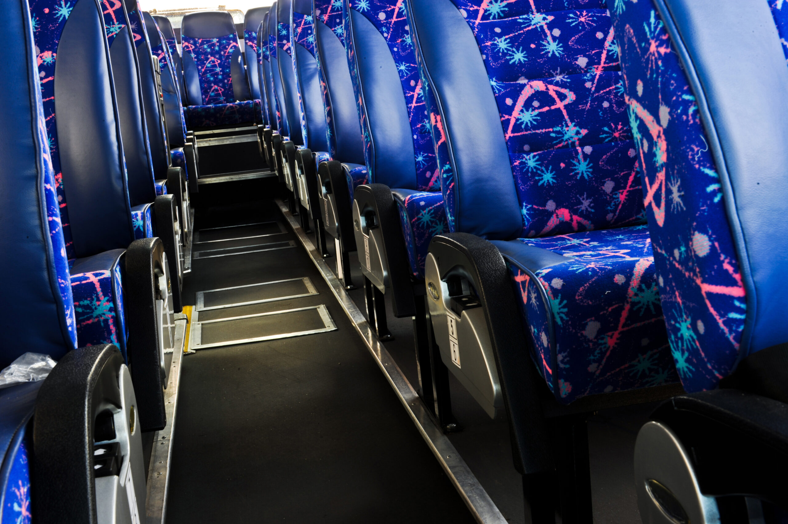 Colorful bus seats inside a Coach bus