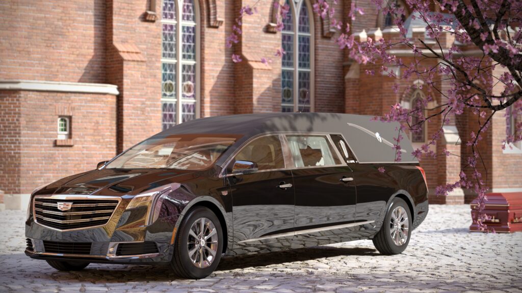 Luxury hearse in front of a brick building