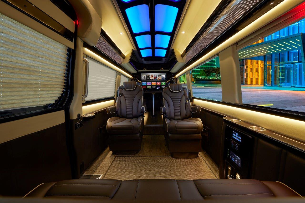 Interior seating and infotainment in a luxury Sprinter van