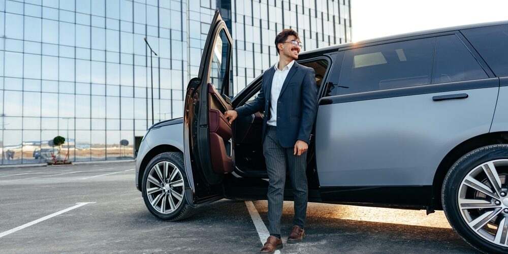 Man stepping out of a luxury SUV Man stepping out of a luxury SUV