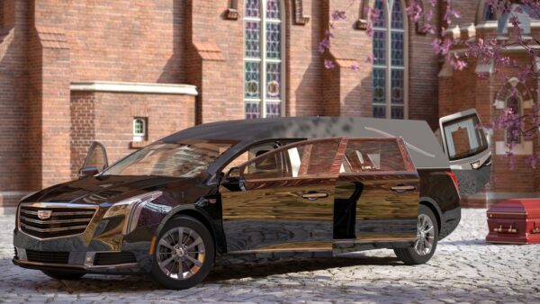 Black Cadillac hearse parked outside a church with doors open and casket nearby, showcasing premium funeral car design