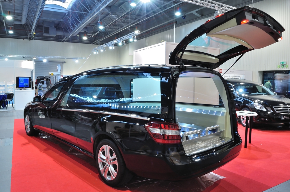 Black funeral hearse for sale with open rear compartment for casket placement